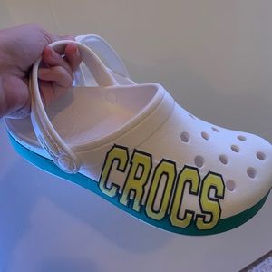 white crocs with green and yellow